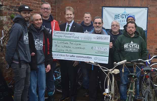 Police and Crime Commissioner Matthew Ellis hands over a cheque to Lichfield Re:Cycle