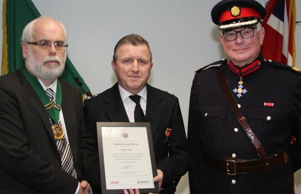Michael Jones receiving his long service award