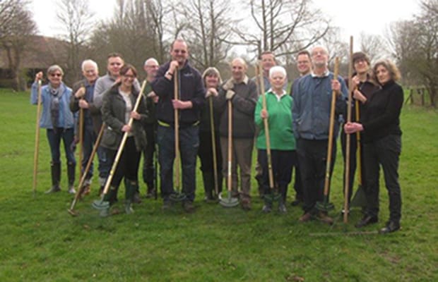 Volunteers sowing poppy seeds
