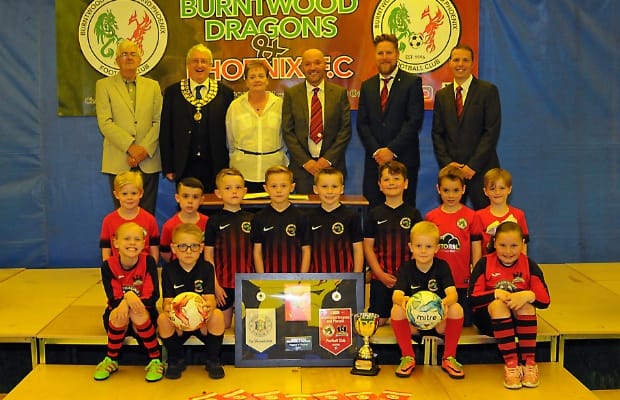 Councillors, club officials and players celebrate the new Coppy Nook lease
