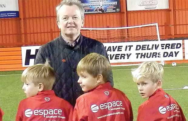 Espace managing director Tony Shally with players from the Whittington Owls U9 team