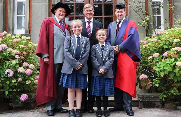 Pupils Katie-Rose Bridgeman and Heidi Fletcher with Dr Neville Brown, Ian Dudson, the Lord Lieutenant of Staffordshire, and Dr Daryl Brown