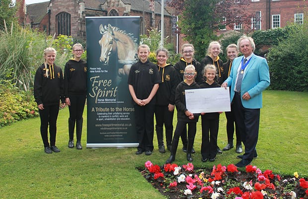 Cllr David Salter handing over the charity cheque
