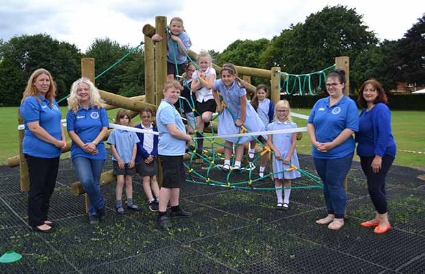 Children enjoying new climbing frame alongside members of the Friends of Hayes Meadow PTA