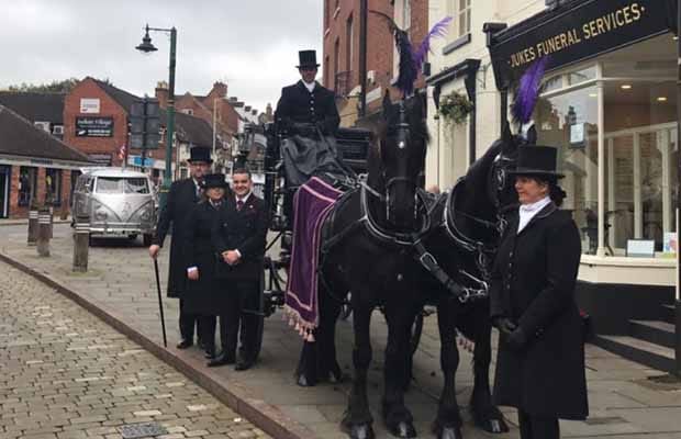 The Jukes Funeral Services team with horse-drawn hearse outside The House of Minster Funeral Home