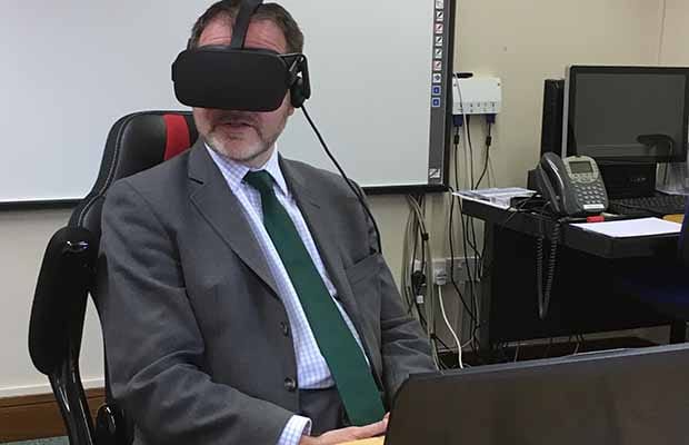 Christopher Pincher wearing the VR headset during his visit to St Giles Hospice