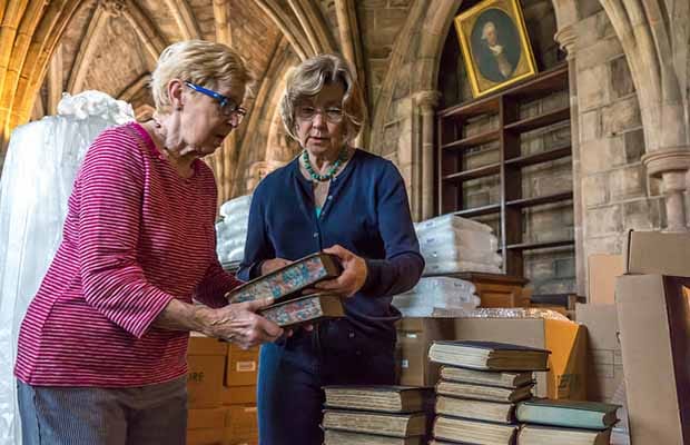 Volunteers packing up books in Lichfield Cathedral's library