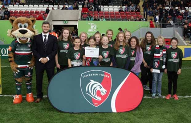 The Lichfield Cathedral School students on the pitch at half-time