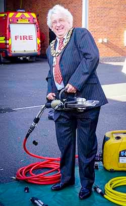 Cllr Mark Warfield tries out some of the equipment at Lichfield Community Fire Station
