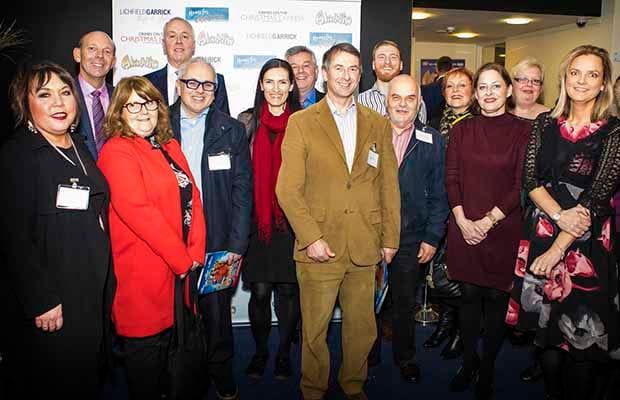 Representatives from the businesses that helped provide pantomime tickets for local families