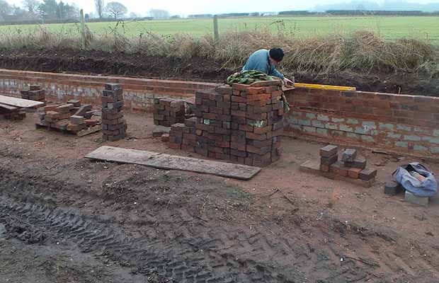 A volunteer working on the canal restoration project