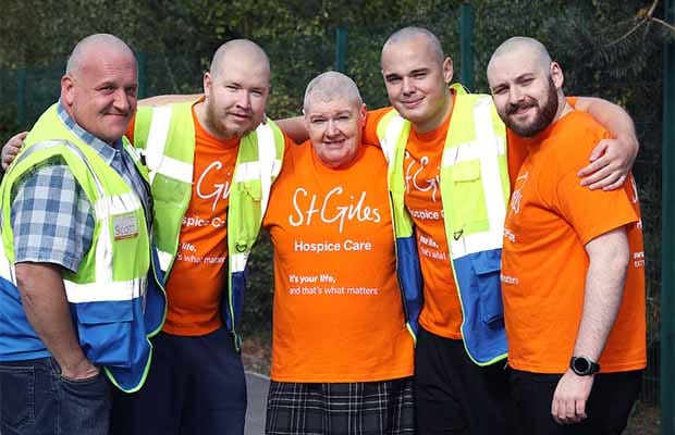 The Amazon workers showing off their newly-shaved heads