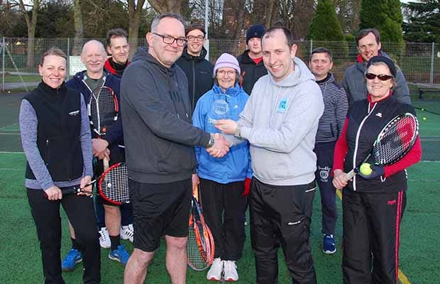 Phil Shaw receiving his award from Phil Jessop with tennis players at Beacon Park