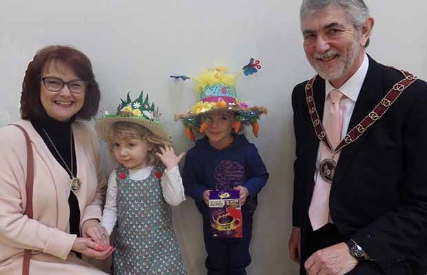 Easter bonnet winners Belle Burton and Thomas West with Cllr David Leytham and his wife Jan