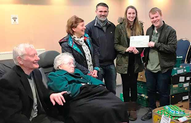 The cheque is handed over to the foodbank in Burntwood