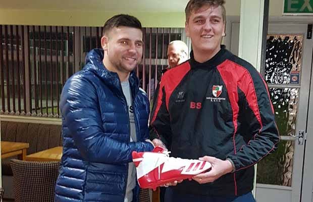 Ben Spencer-Kibble being presented with his new boots by Ben Youngs