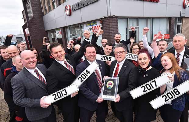 The Bristol Street Motors Lichfield team with Denis Chick, communications director at Vauxhall Motors