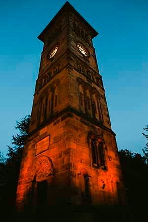 Lichfield Clock Tower lit up by West Midlands Railway