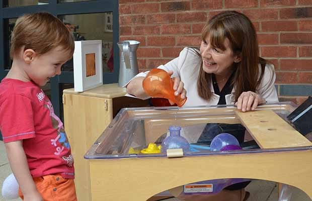 Marg Randles with a youngster from Busy Bees