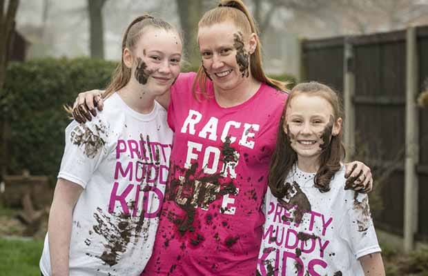 Bethany Jennings, her sister Sophie and mum Becky getting ready for Cancer Research UK's Pretty Muddy Kids run at Weston Park