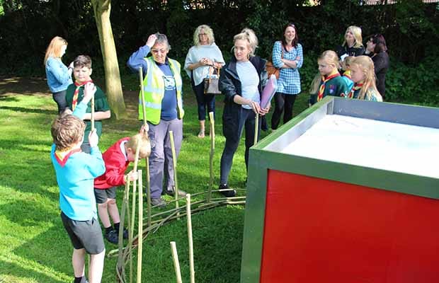 Members of the Foresters Scouts Group working on the narrow boat on Tamworth Road