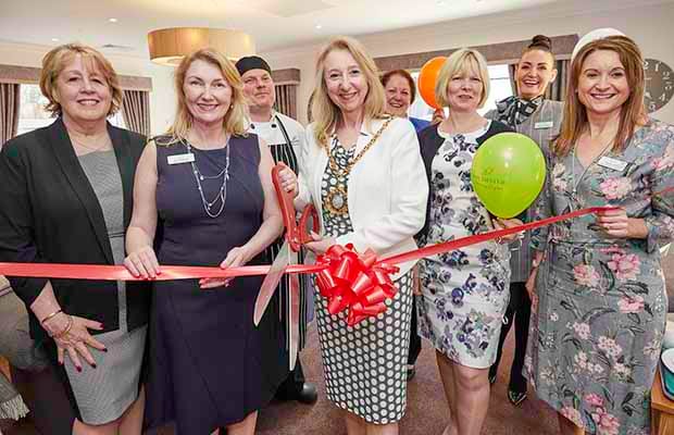 Cllr Janice Greaves cuts the ribbon at The Spires care home