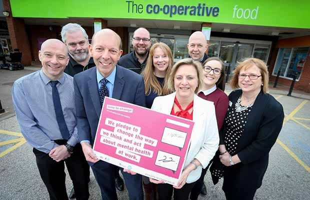 Central England Co-operative Society staff celebrating signing the Time to Change mental health pledge