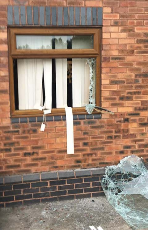 A window smashed by vandals. Pic: Burntwood RUFC