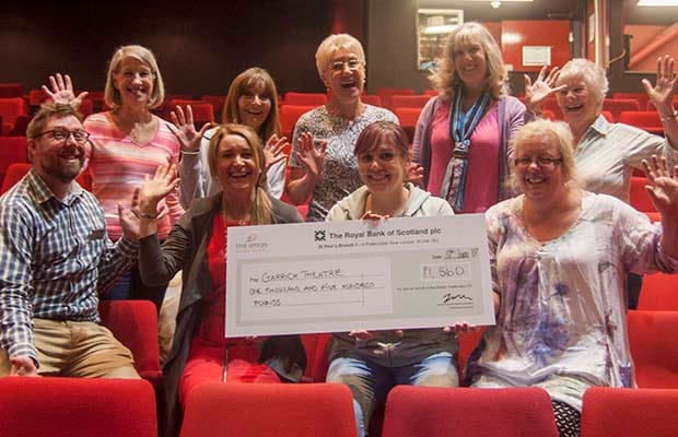 The cheque is handed over at the Lichfield Garrick