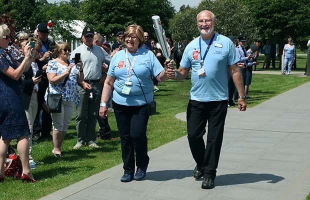 Volunteers carrying the baton through the National Memorial Arboretum