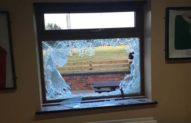 A smashed window at Burntwood Rugby Club