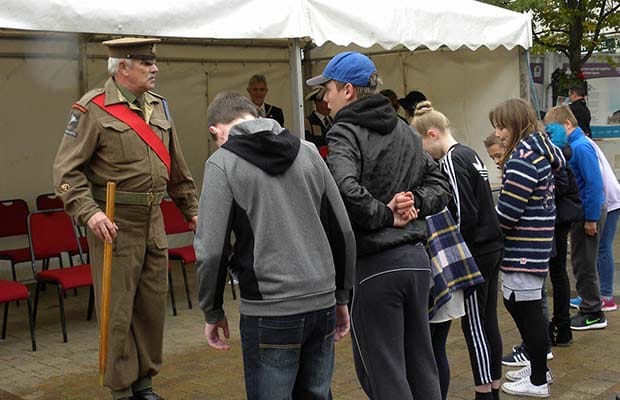 A sergeant major putting young 'recruits' through their paces