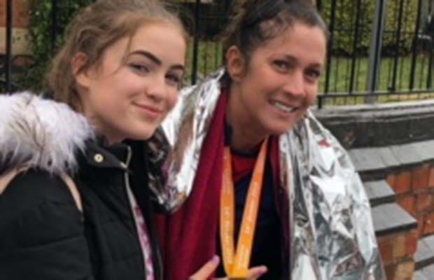 Jayne Whitehouse with her daughter Faith after completing the last race in her marathon challenge