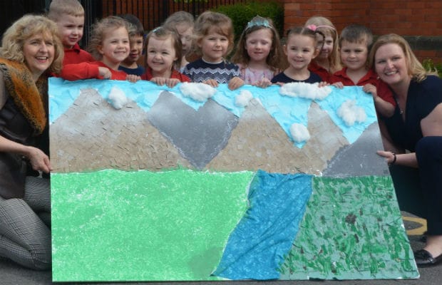 Children with their Everest mural created for Karen Mackay and Yvonne Smillie
