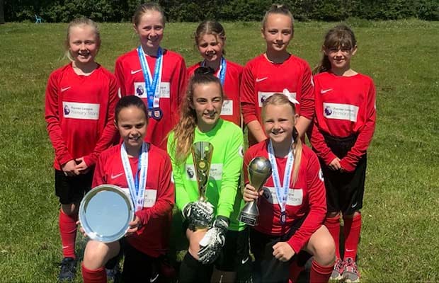 The Fulfen Primary School team with some of their silverware