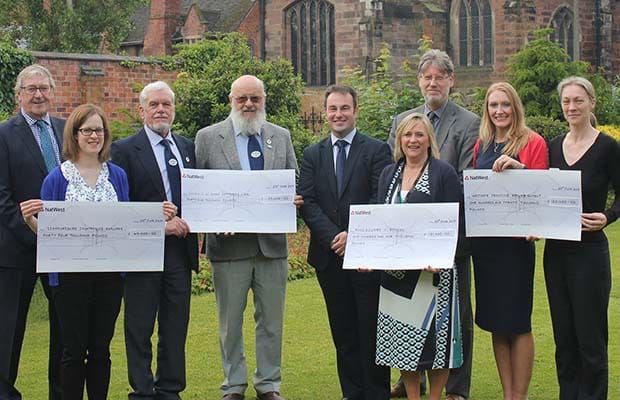 Cllr Iain Eadie (centre) with representatives from the successful organisations