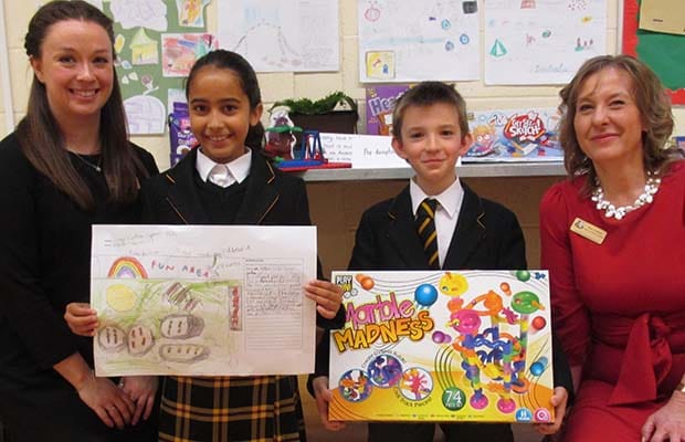 George Eardley Taylor and Nadia Fallouh, are pictured with their prize alongside teachers Julie Peters and Laura Rack