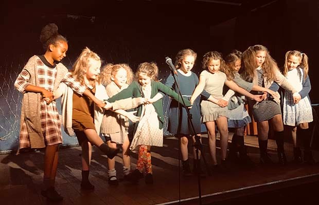 Students performing in Annie Jr