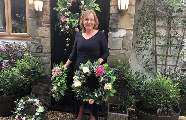 Julie Peters with some of her wreaths