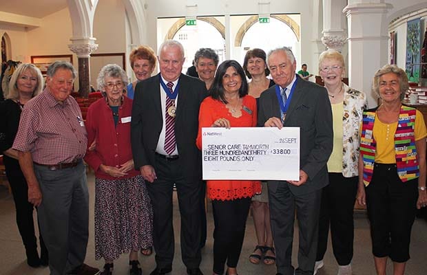 Bob Awty handing over the cheque to Lichfield Memory Cafe