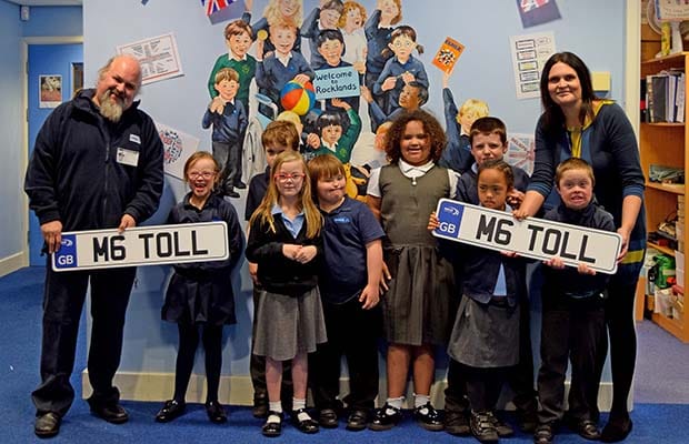 Ian Harvey from M6 Toll with teacher Claire Dryhurst and pupils from Rocklands School