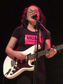 A MOMO Academy of Drama student showcasing their musical skills