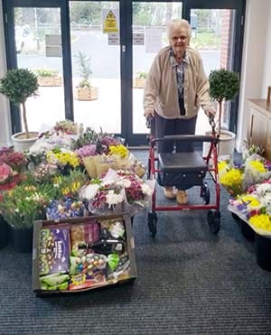 The Spires resident May with some of the flowers delivered by Lidl
