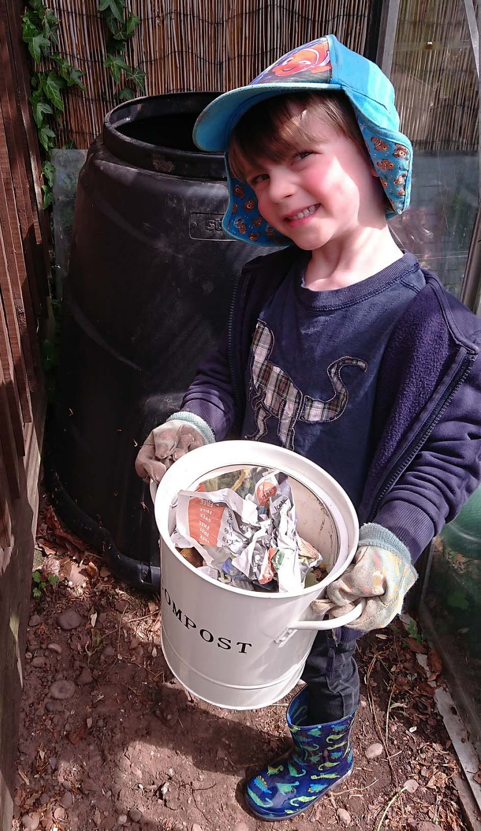Oliver taking waste to the composting bin