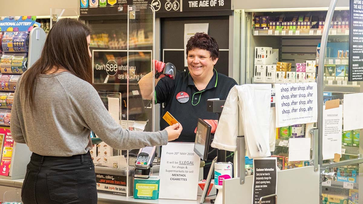 A customer being served by a member of staff at Central England Co-op in Lichfield