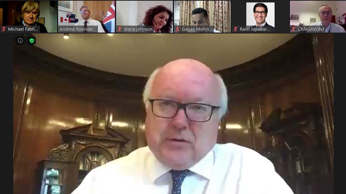 George Brandis QC speaking at the meeting with Michael Fabricant MP (top left)