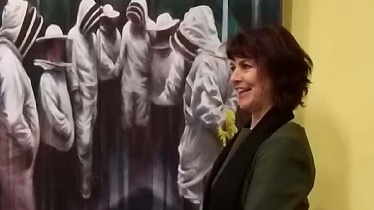 Angela Maloney with one of her paintings