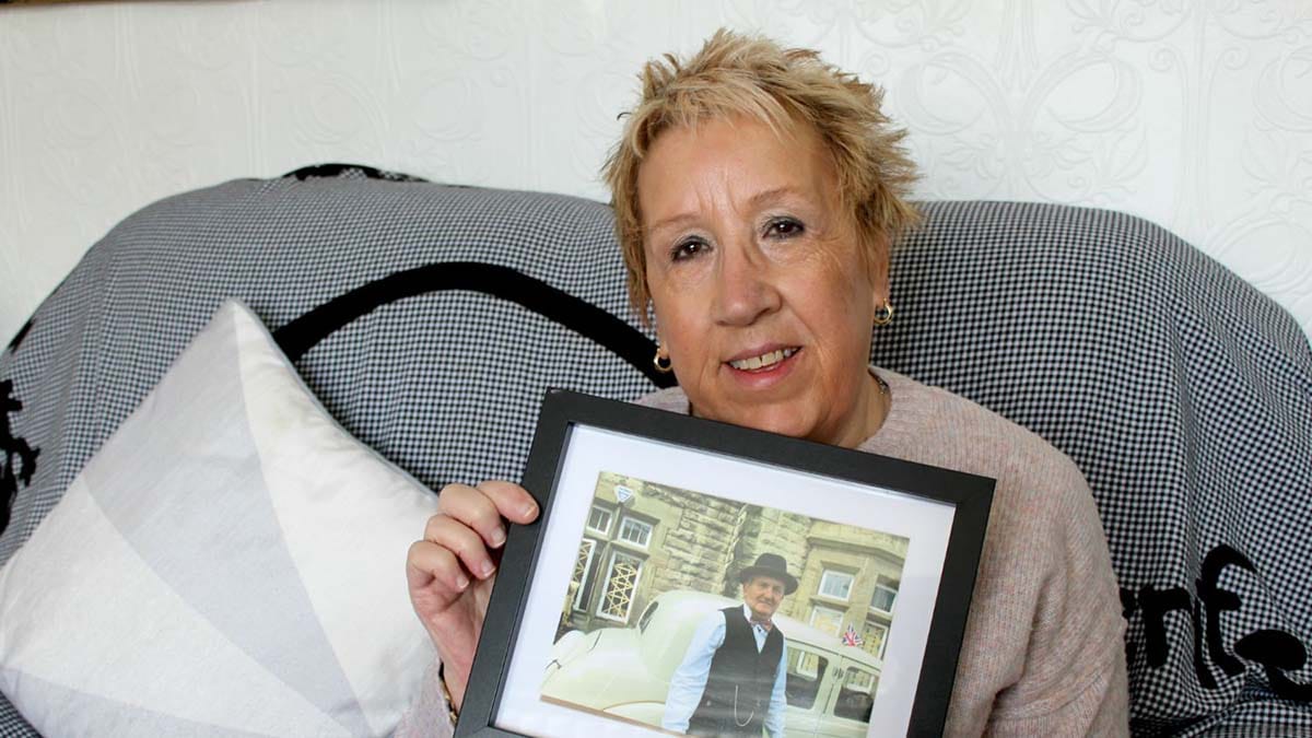 Denise Walker with a picture of Peter Badger