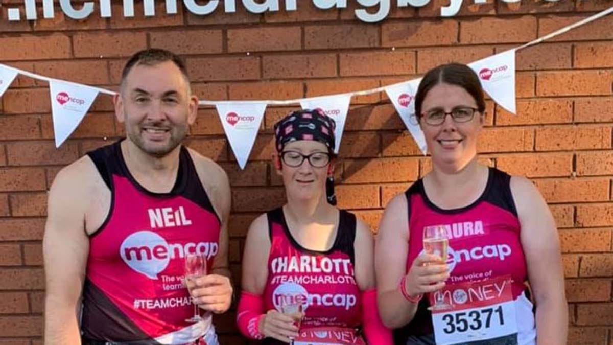 Charlotte Aspley (centre) celebrating completing the marathon distance with her support team