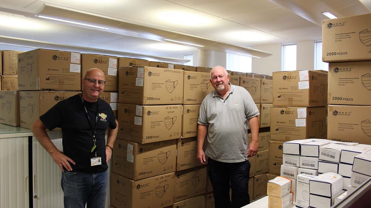 Staffordshire County Council staff John Challinor and Paul Forrester packing PPE